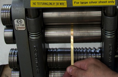 Feeding a test strip into the mill